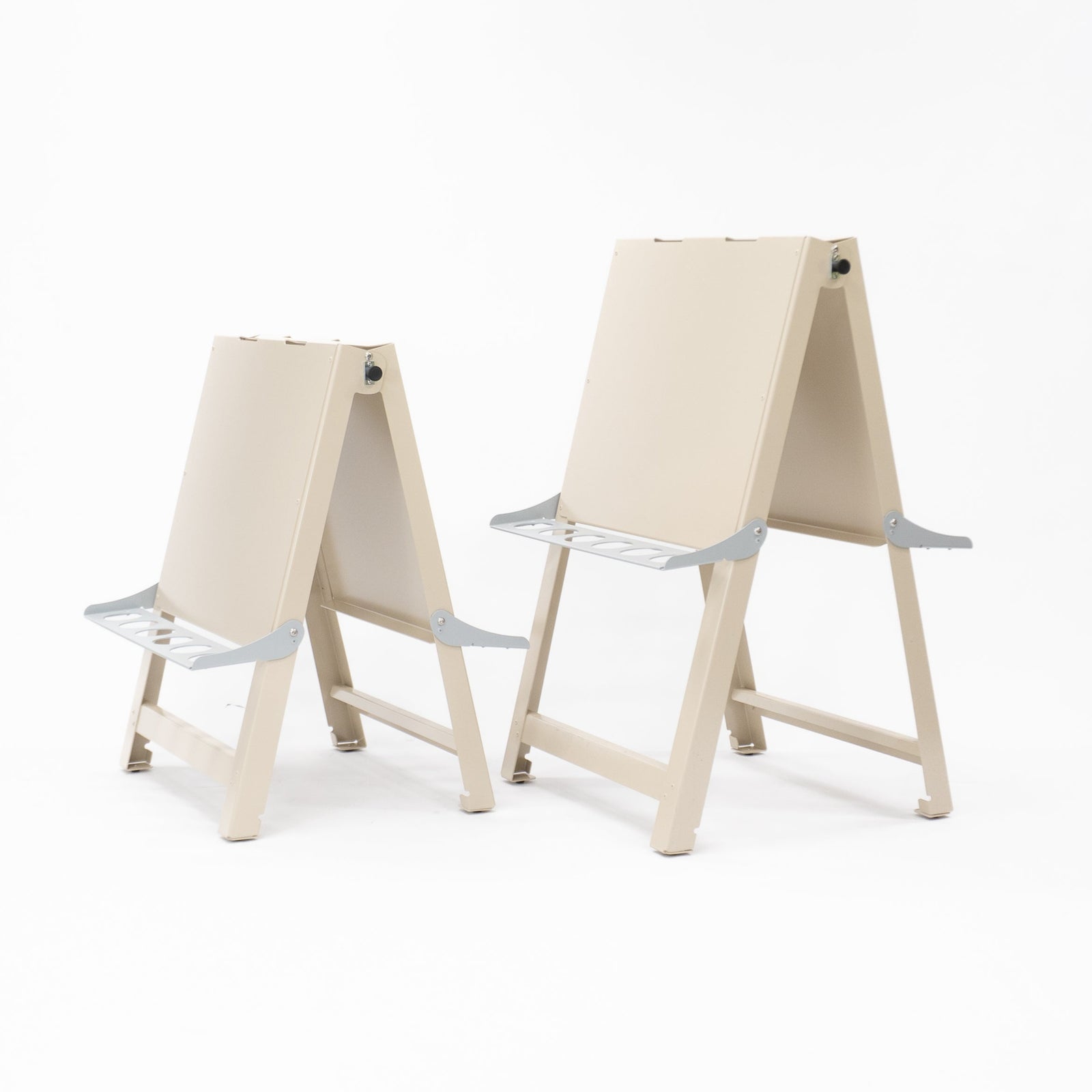 Australian-made medium double-sided painting easel folded flat for compact storage. Durable aluminium and powder-coated steel frame built for daily use by educators in childcare, preschool, daycare and early learning environments.