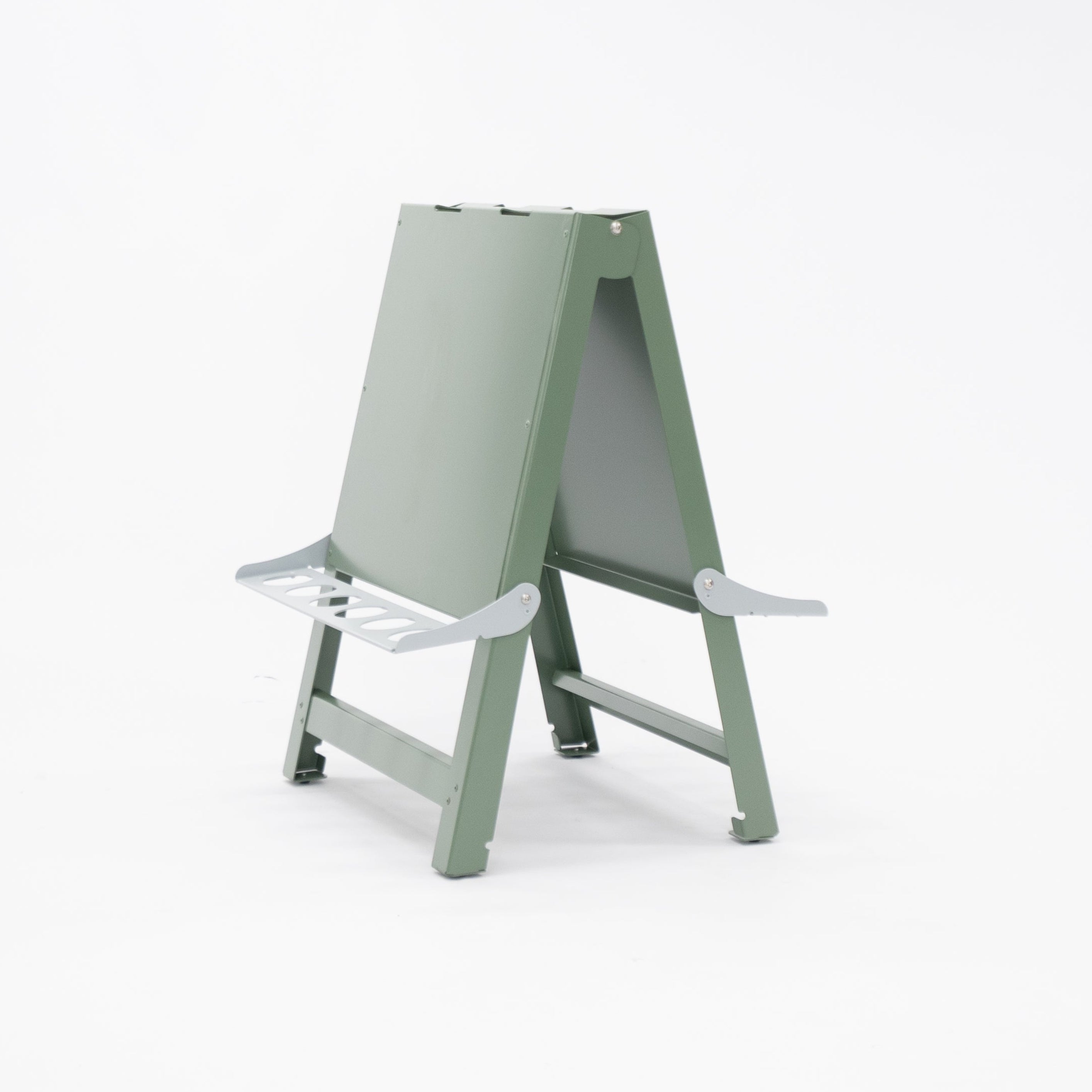 Australian-made toddler double-sided painting easel folded flat for compact storage. Lightweight aluminium and powder-coated steel frame wipes or hoses clean with ease. Built for daily indoor and outdoor use in childcare, preschool, daycare and early learning environments.