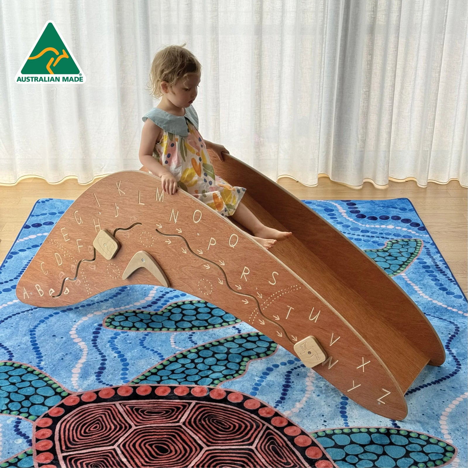 Boomerang Slippery Dip — Australian-made boomerang-shaped wooden slippery dip slide for early childhood active play